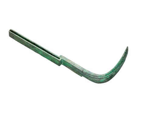 **A GREEK OR ROMAN BRONZE STRIGIL, PROBABLY 500 B.C.- 500 A.D. the blade curved into a right angle, of semicircular section, 