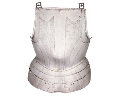 A GERMAN BREASTPLATE WITH EMBOSSED DECORATION IN THE 'BLACK AND WHITE' FASHION, CIRCA 1570 formed of a medially-ridged main p