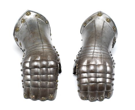 **TWO NORTH GERMAN MITTEN-GAUNTLETS, PROBABLY BRUNSWICK, CIRCA 1560-70 not a pair but probably deriving from the same series 