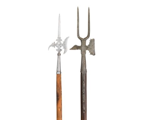 **A GERMAN HALBERD, 18TH CENTURY AND A HALBERD, PERHAPS 18TH CENTURY the first with tapering central blade moulded at the bas