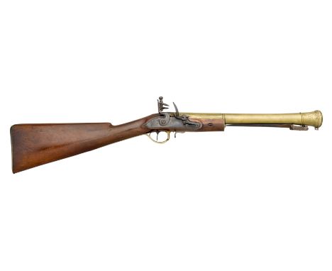 A FLINTLOCK BLUNDERBUSS BY PRUDDEN, CIRCA 1800 with brass barrel formed in three stages and swelling towards the muzzle, fitt
