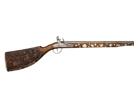 AN UNUSUAL 24-BORE GERMAN FLINTLOCK GUN, EARLY 19TH CENTURY, BUILT ON AN EARLIER STOCK INLAID WITH MOTHER-OF-PEARL AND FINELY