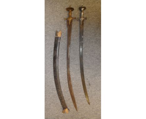 **TWO INDIAN SWORDS (TALWAR), LATE 19TH CENTURY the first with curved fullered blade and characteristic iron hilt decorated o