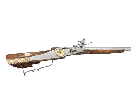 A 120-BORE GERMAN WHEEL-LOCK SPORTING CARBINE, CIRCA 1630-40 with shortened octagonal barrel cut with eight very narrow groov