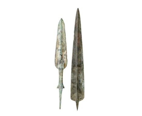 TWO NORTH-WEST PERSIAN BRONZE SPEARHEADS, AMLASH 1200-1100 B.C. AND MARLIK 14TH/10TH CENTURY B.C. in excavated condition, the