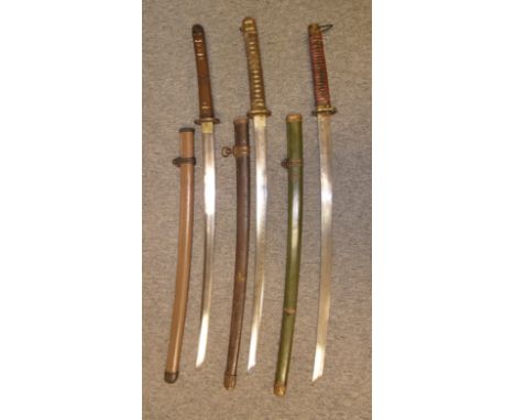 THREE JAPANESE SWORDS (KATANA) the first W.W.II, with curved single-edged blade with wavy hamon (worn), tang signed 'Katsumas