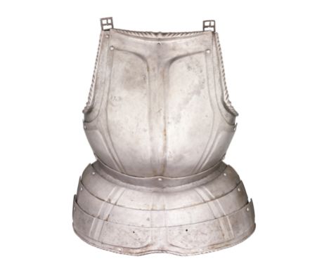 A SOUTH GERMAN BREASTPLATE WITH EMBOSSED DECORATION IN THE 'BLACK AND WHITE' FASHION, NUREMBERG, CIRCA 1540-50 formed of a ro