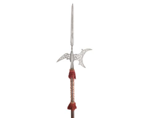 **A NORTH EUROPEAN HALBERD, EARLY 17TH CENTURY with forward-leaning axe-blade pierced with numerous shaped apertures and form