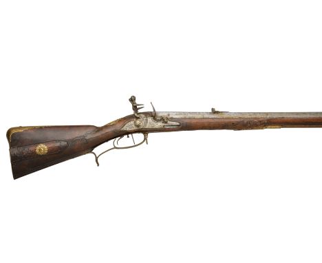 A 22-BORE GERMAN FLINTLOCK SPORTING RIFLE, CIRCA 1730 with octagonal twist barrel swamped at the muzzle, inlaid with a silver