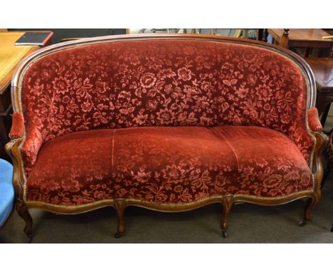 Mahogany sofa with arched back over a break front frieze and raised on moulded cabriole supports, 175cms wide  