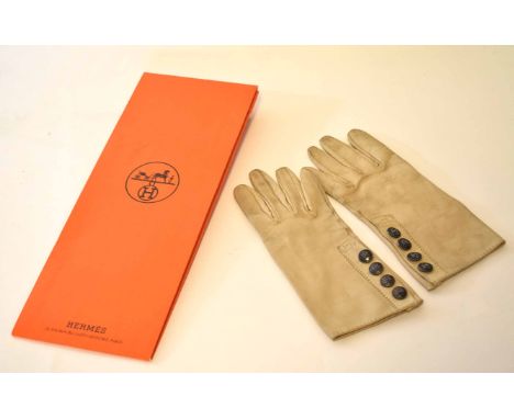 Pair of late 20th century ladies kidskin gloves, Hermes, of stitched beige form and each fitted with four monogrammed working