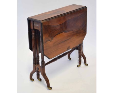 Victorian mahogany and simulated rosewood Sutherland table, two drop flaps with canted corners, ring turned uprights and stre