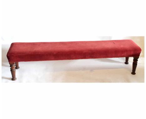 Victorian rosewood simulated window seat or bench, of rectangular form with red upholstered seat and raised on ring turned su