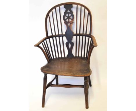 19th century stick back Windsor armchair with wheel splat and with solid seat  