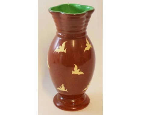 Unusual Clarice Cliff vase with quatrefoil top, the vase with white birds on a brown ground, 32cm high  