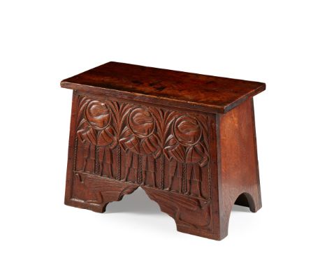 ENGLISH SCHOOL ARTS &amp; CRAFTS COFFER, CIRCA 1910elm, with hinged lid, decorated to the front with a frieze carved with bir