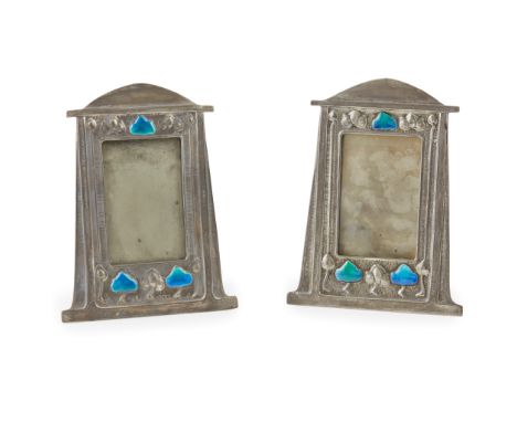 ATTRIBUTED TO LIBERTY &amp; CO., LONDON PAIR OF ARTS &amp; CRAFTS PEWTER AND ENAMEL PHOTOGRAPH FRAMES,each cast with stylised