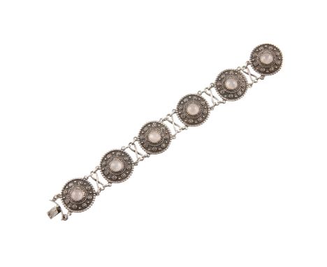 SCOTTISH SCHOOL CELTIC REVIVAL STYLE WHITE METAL &amp; ROSE QUARTZ BRACELET, CIRCA 1910six circular bosses each set with a ro