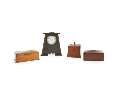 ENGLISH SCHOOL, MANNER OF C.F.A. VOYSEY ARTS &amp; CRAFTS STAINED OAK MANTEL CLOCK, CIRCA 1910with enamelled dial and tapered