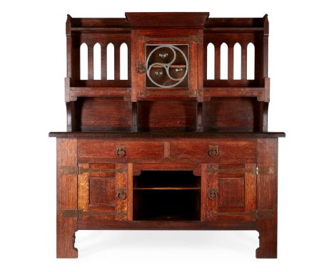 LIBERTY &amp; CO., LONDON ARTS &amp; CRAFTS OAK SIDEBOARD, CIRCA 1900the pierced superstructure with central cupboard door, a