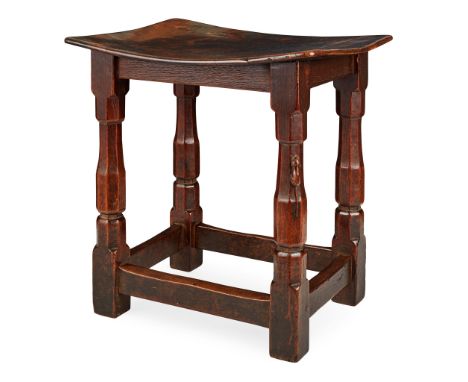 ROBERT 'MOUSEMAN' THOMPSON (1876-1955) EARLY OAK STOOL, CIRCA 1930the rectangular dished burr seat on faceted baluster turned