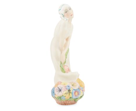 IGNI, TORINO ART DECO CERAMIC FIGURE OF A WOMAN, CIRCA 1930modelled as a woman standing over a basket of flowers, signed to b