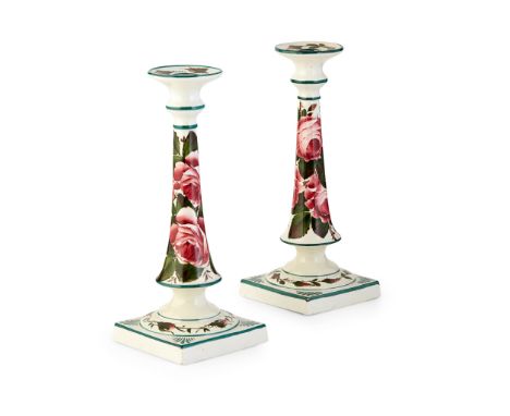 WEMYSS WARE A PAIR OF TALL SQUARE CANDLESTICKS, ‘CABBAGE ROSES’ PATTERN, CIRCA 1900each with impressed maker's marks WEMYSS W