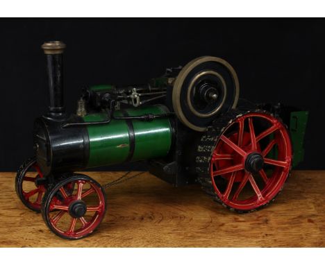 A live steam model traction engine, green livery, fitted with English style brass straked wheels, 3.5" solid cast brass flywh