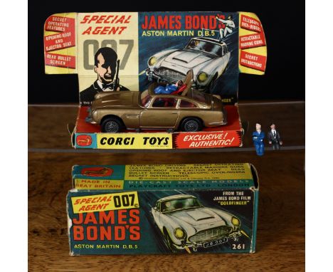 Corgi Toys 261 Special Agent 007 James Bond Aston Martin D.B.5 from the James Bond film "Goldfinger", gold body, seated plast