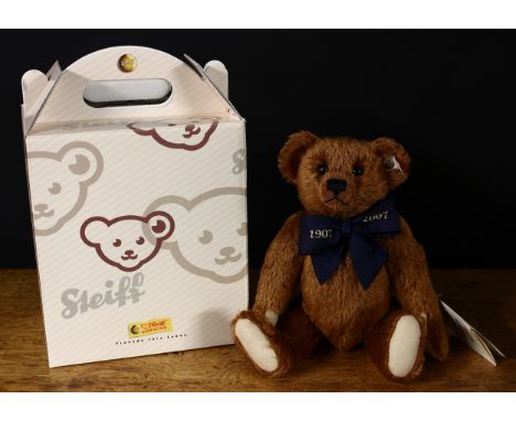 Steiff (Germany) EAN 038785 "A Million Hugs" teddy bear, trademark Steiff button to ear with red and white tag, 28cm high, bo