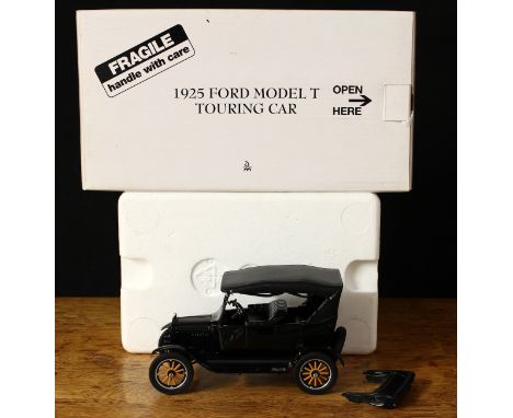 A Danbury Mint 1:24 scale Ford Model T touring car, boxed with original inner polystyrene packaging pieces