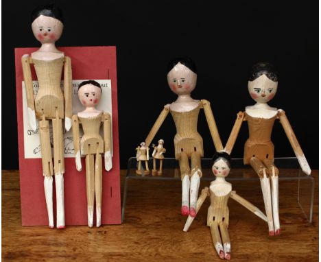 A collection of novelty wooden peg dolls/Dutch dolls or Grödner Gliederpuppen, various sizes ranging from 4cm high to 25cm hi