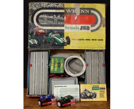 A G.&amp;R. Wrenn Formula 152 triple electric model motor racing set, comprising a green B.R.M. type R.C.11 racing car with b