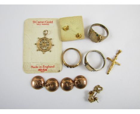 Gold jewellery, comprising vintage 'new old stock' novelty fob in the form of a ships wheel, a yellow metal crucifix, marked 