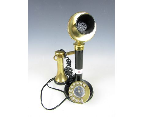 A reproduction candlestick telephone