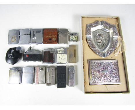 A quantity of vintage cigarette lighters and related material including a KKW camera lighter