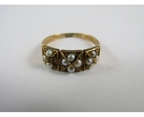 A Victorian 15ct gold and split seed pearl dress ring, the face divided into three square cells, each set with four split see