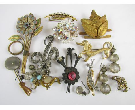 Vintage costume jewellery including a white metal brooch set with paste stones, stamped silver, and sundry other brooches and