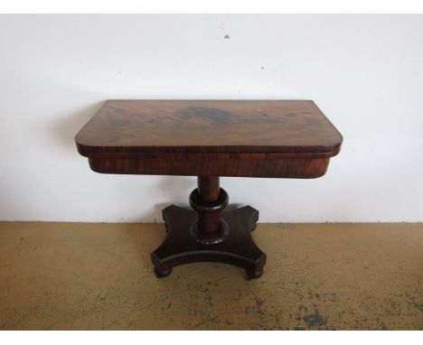 A George IV mahogany pedestal card table