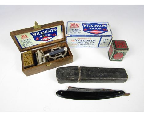 An early 20th century Wilkinson Empire model safety razor in original packaging together with a Victorian cut throat Lancet E