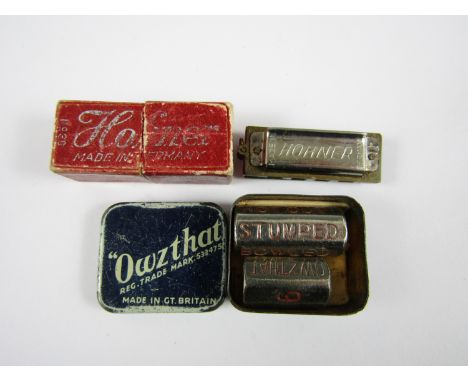 A Hogner mini harmonica together with an Owzthat pocket cricket game