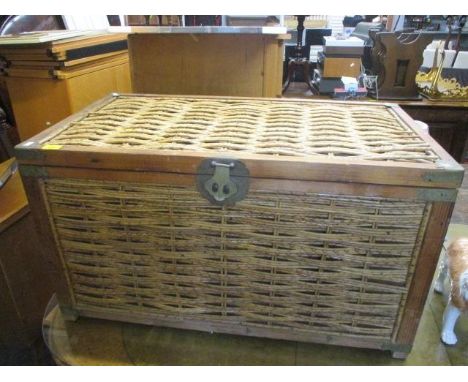 A mid 20th century pine and bamboo trunk with contents to include a skateboard and roller skates 
