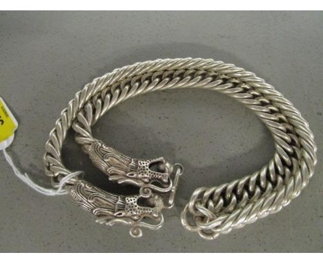 A Chinese white metal curb link necklace with dragon head and pearl terminals 