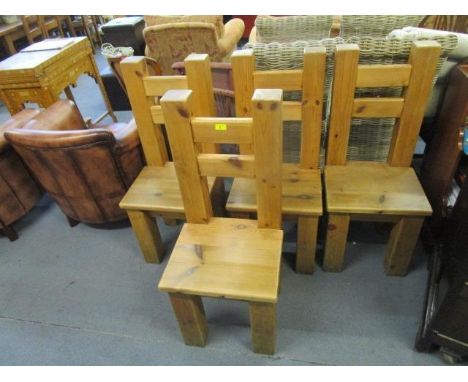 A set of four contemporary light oak dining chairs 
