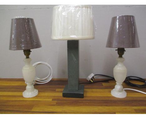 A pair of Italian Onyx, turned table lamps with shades and a green slate table lamp with a shade in working order. 