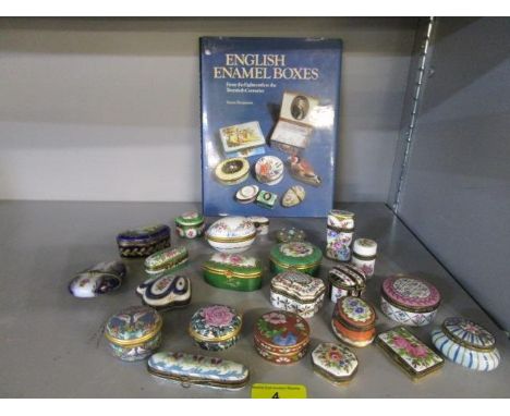 A collection of Limoges, other French porcelain pill boxes, two Halcyon Days enamel boxes, and a book on English Enamel Boxes