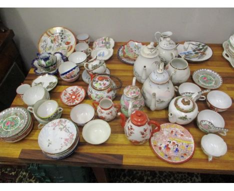 Japanese ceramics to include mainly teaware, seven teapots, a dish, cups, saucers and plates 