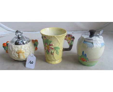 A Clarice Cliff Harvest sucrier, Falcon Ware preserve jar and Carlton Ware mug