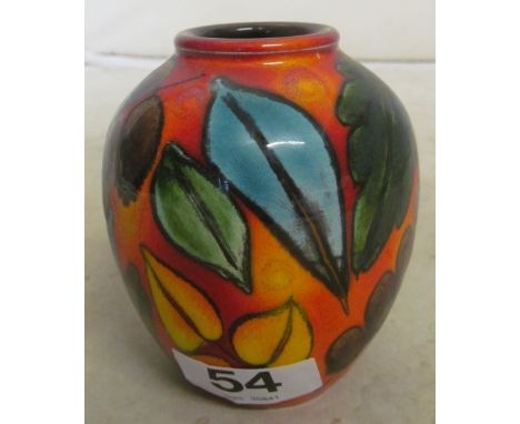 A small Poole RU pottery vase orange ground with leaves and fruit, by L. Wimarsh