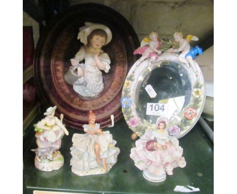 A porcelain mirror, model of girl in frame, two filigree figures and figure